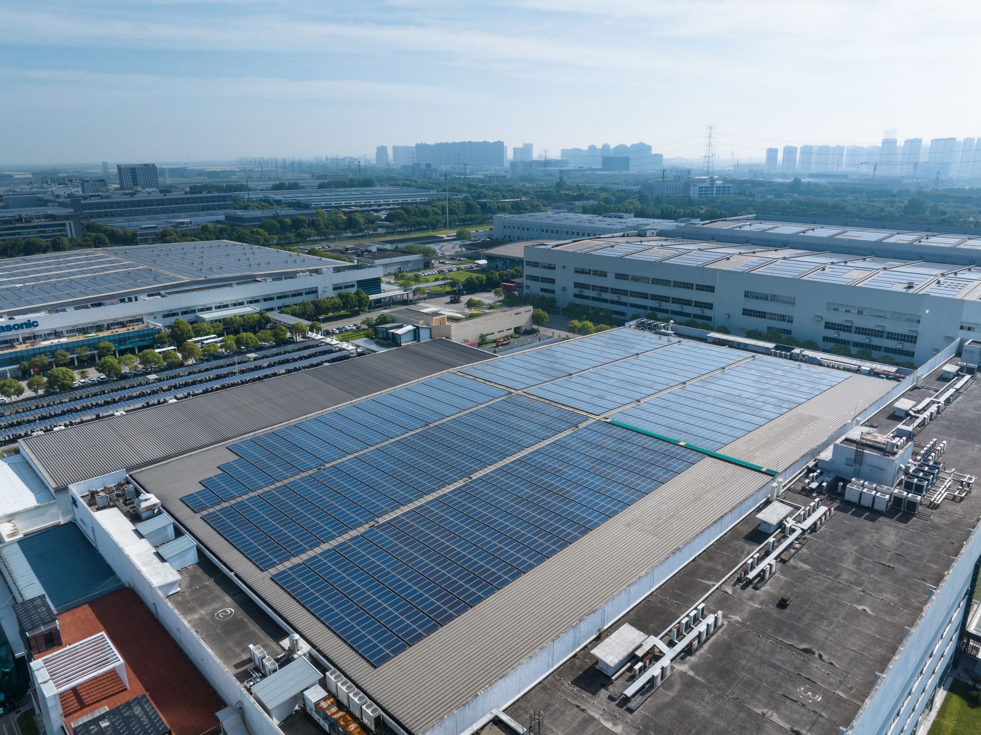 Solar energy panels installation on roof of commercial building