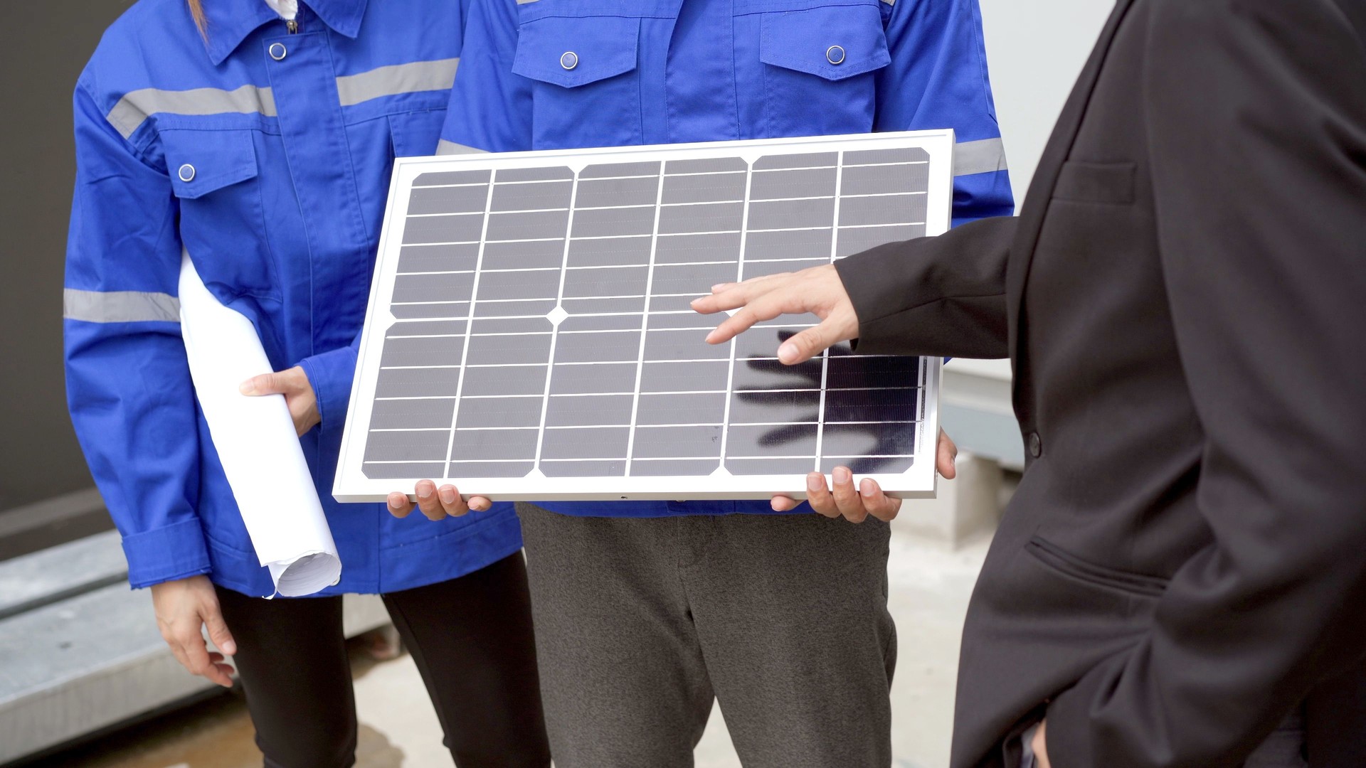 Sales engineer team presenting a solar panel system.